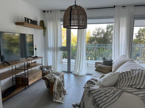 โทรทัศน์และ/หรือระบบความบันเทิงของ Escapada de Lujo Vista Mar y Golf Playa Grande