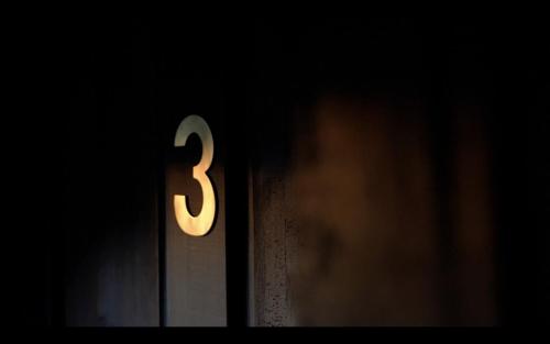 a number three sign on a door in the dark at Barinka in Světec