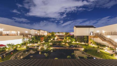 an aerial view of the courtyard of a resort at night at Art Hotel Osaka Bay Tower in Osaka