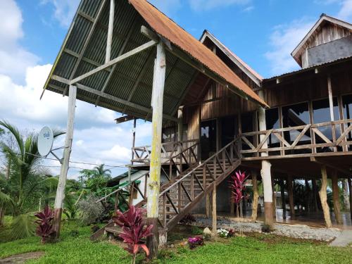 a house with a staircase in front of it at My Country House Paradise, Rio Celeste! in San Rafael