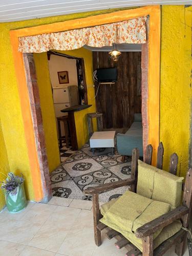 a room with a couch and a chair in a room at Aguas Dulces in Aguas Dulces