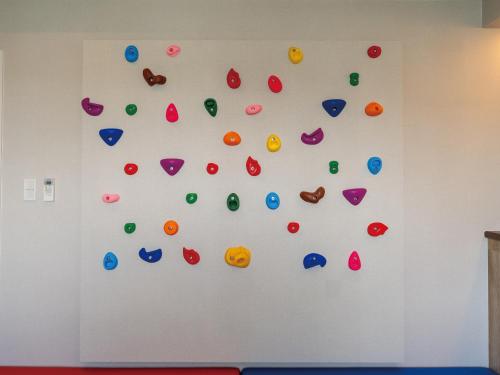 a wall with many different colored buttons on it at Family Condo Chatan Hills by Coldio Premium in Chatan