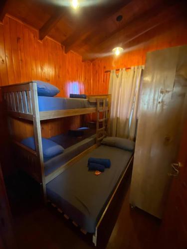 Postel nebo postele na pokoji v ubytování Cabaña Lanèr