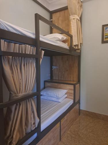 a couple of bunk beds in a room at Tam Coc Guest House & Hostel in Ninh Binh