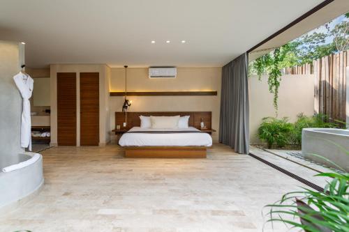 Katil atau katil-katil dalam bilik di Faisano Boutique Hotel