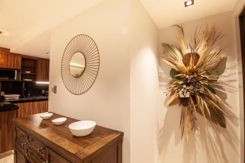 a bathroom with a sink and a mirror on the wall at Nowness in Mexico City