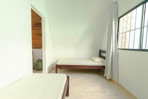 Postel nebo postele na pokoji v ubytování Chalés da Aldeia