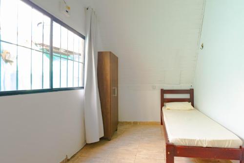Postel nebo postele na pokoji v ubytování Chalés da Aldeia