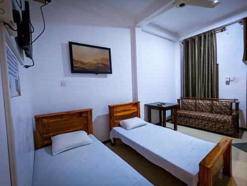 Tempat tidur dalam kamar di Hotel Change Badulla