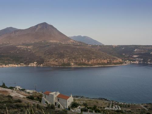 a view of a body of water with a mountain at Selana View in Karavostasion