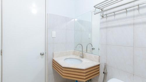 a bathroom with a sink and a mirror at RedDoorz at BP International near SM Manila in Manila