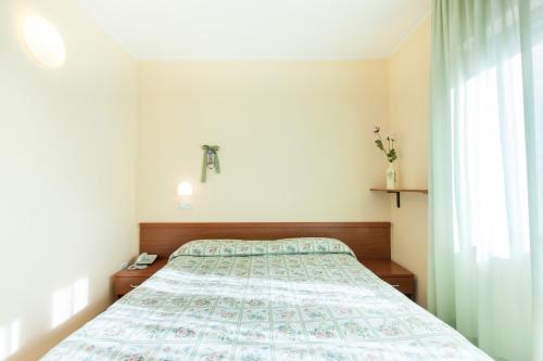 Postel nebo postele na pokoji v ubytování Hotel Fabbrini