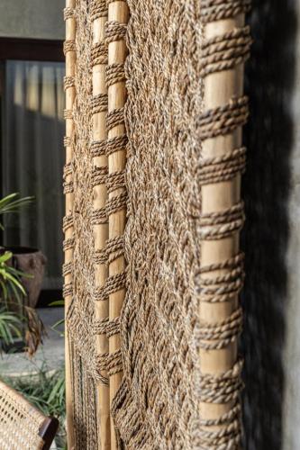 a close up of the side of a building at Kano Twin in Canggu