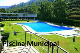 a large swimming pool in the middle of a field at Alojamento Correia in Caldelas