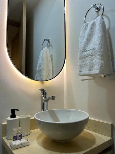 a bathroom with a sink and a mirror at • POWER STYLE • Apto con terraza in Bogotá