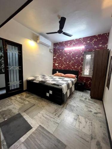 A bed or beds in a room at Mayura home