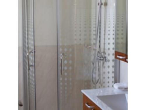 a bathroom with a shower and a sink at O'sinkirri in Nairobi