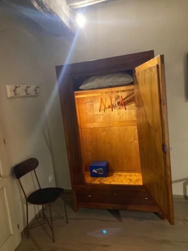 a room with a wooden bunk bed with a chair at EL TANO in Città della Pieve