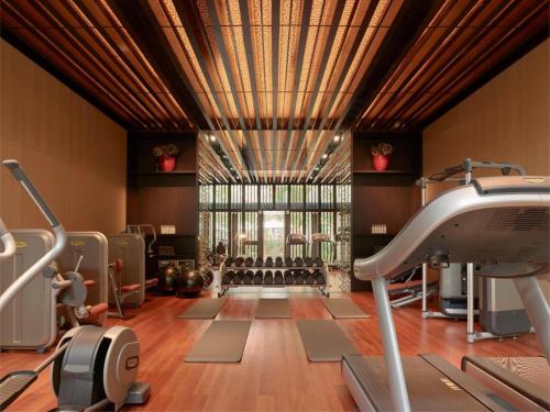 a gym with exercise equipment and a large window at 1 Bedroom near KLCC, Jalan Kia Peng in Kuala Lumpur
