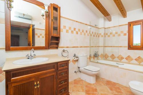 a bathroom with a sink and a toilet and a tub at Cas General -Santa Eugenia- in Santa Eugenia