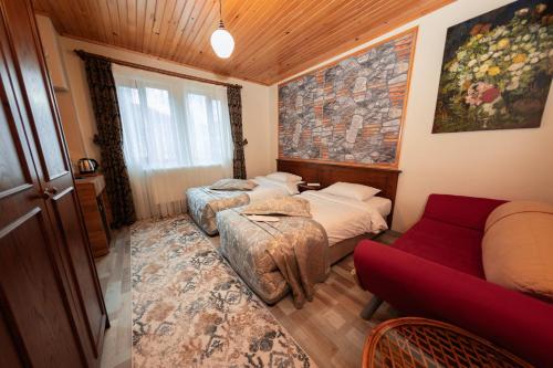 Postel nebo postele na pokoji v ubytování Abant Doğa Köşkü