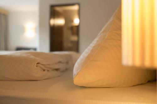 a close up of two pillows on a bed at Haus Barbara in Alpbach