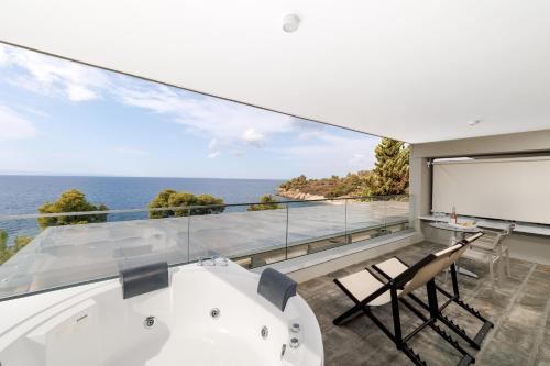 a view of the ocean from the balcony of a house at Casa Bloo Adults Only in Elia