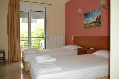 Postel nebo postele na pokoji v ubytování Marvi Hotel