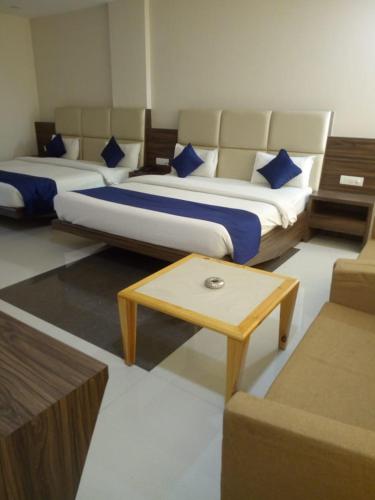 Voodi või voodid majutusasutuse MNR Resort toas