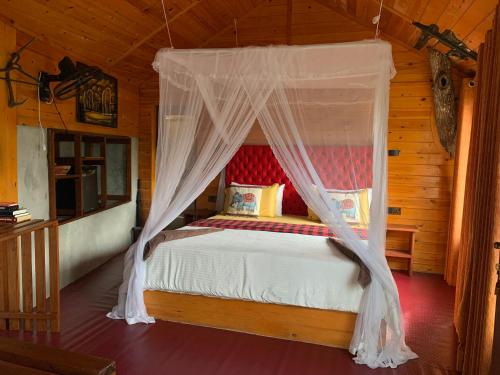 Postel nebo postele na pokoji v ubytování Mc Queen Homestay