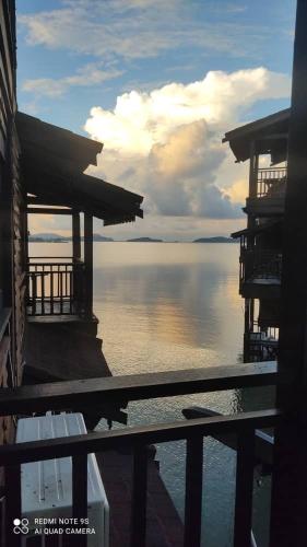 a view of a body of water from a building at the sunset view lagoon suite in Pantai Cenang