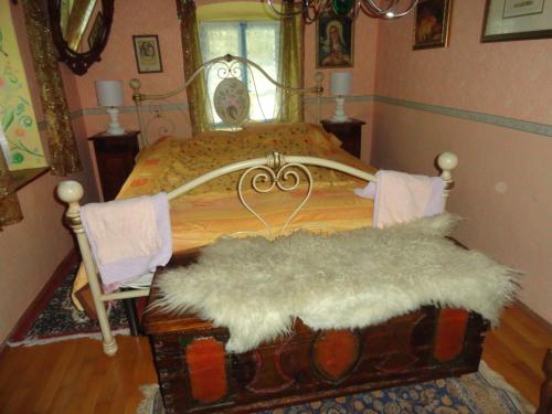 a bedroom with a bed with a white furry mattress at Pri Maku in Tolmin