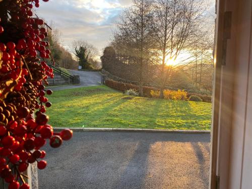 an open door with a view of a road at Rostrevor Valley 6-Br Sleeps 20 w Hot Tub & View in Newry