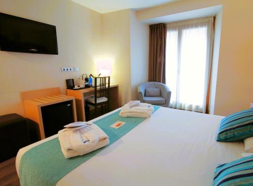 Cama o camas de una habitación en ELE Enara Boutique Hotel