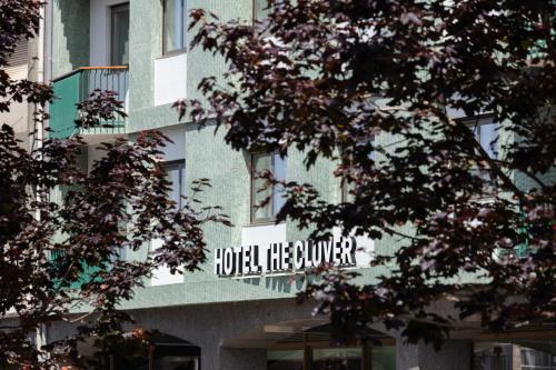 a building with a sign on the side of it at Acta The Clover in Porto