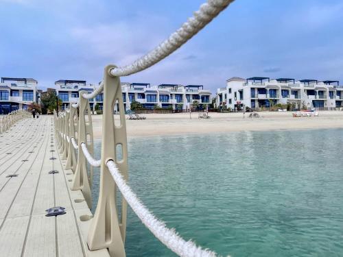 Stunning Palm Villa with Rooftop Garden, Resort Style Pool and Beach by Exclusive Holiday Homes