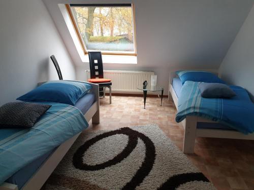 Postel nebo postele na pokoji v ubytování NEU! FeWo Maya mit Sauna