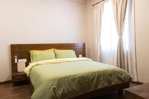 Postel nebo postele na pokoji v ubytování Kibu Apartments