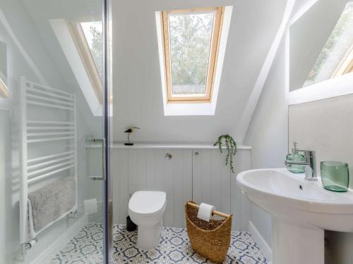 a white bathroom with a sink and a toilet at 1 Bed in Hereford 83703 in Wormbridge