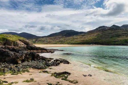 a view of a beach with mountains in the background at The Rusty Nail in Kindrohid