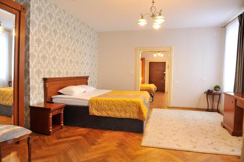 Letto o letti in una camera di Safrano Palace