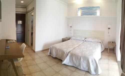 Ένα ή περισσότερα κρεβάτια σε δωμάτιο στο Hotel Bahía