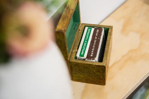 a wooden box with a battery on a table at Miracolo al Duomo Smart Accomodations in Naples
