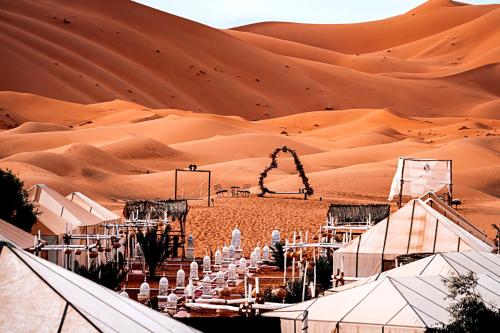 a desert wedding in a marquee in the desert at Fabulous luxury camp in Merzouga