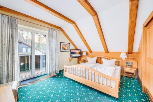 Postel nebo postele na pokoji v ubytování Hotel Garni Nuss