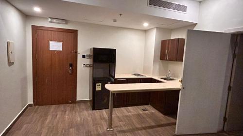 Kuchyň nebo kuchyňský kout v ubytování Al Madinah ANASAT Hotel