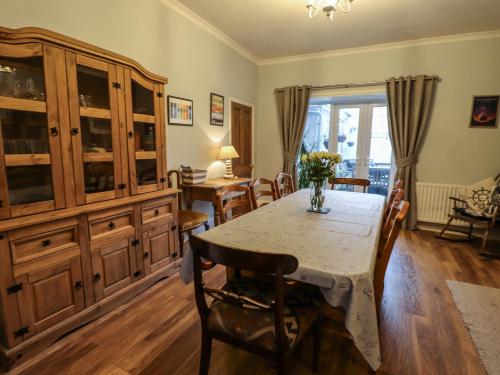 a dining room with a table and chairs at Number Seventeen in Amble