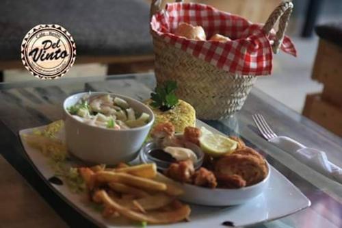 a plate of food on a table with a basket of food at MONDIAL HOTEL in Tunis