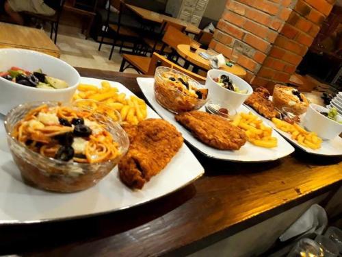 a table with three plates of food on it at MONDIAL HOTEL in Tunis