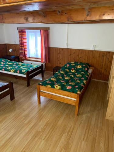 Letto o letti in una camera di Horská bouda Šubišák